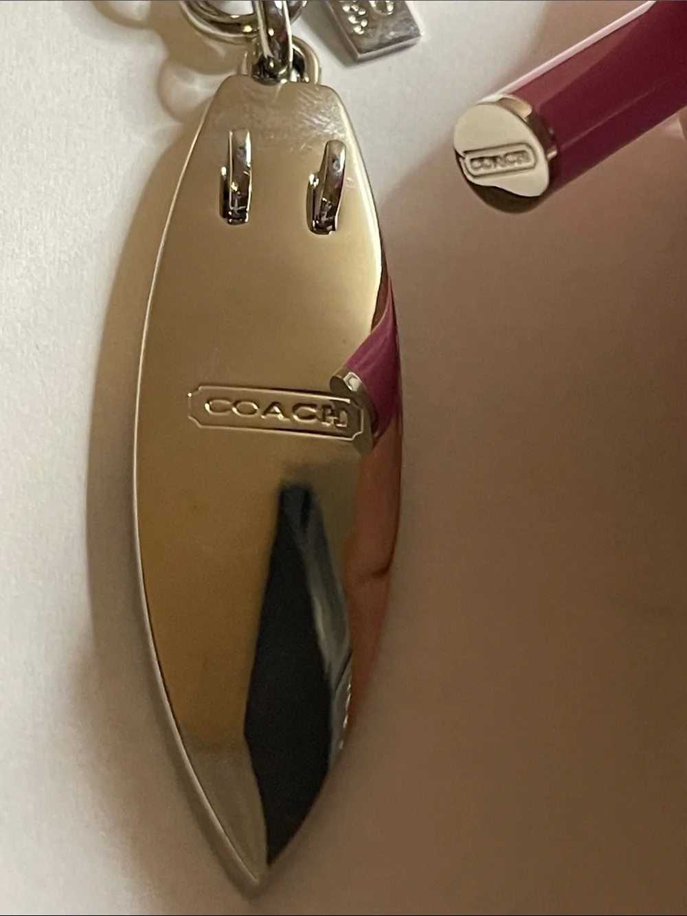 Coach Surfboard Keychain in Pink and Cream and Pink Coach Pen